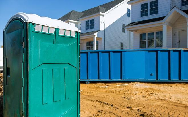 portable toilet and dumpster at a construction site project in Oakland Park FL